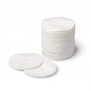 Stack of soft white cosmetic cotton pads isolated on white background
